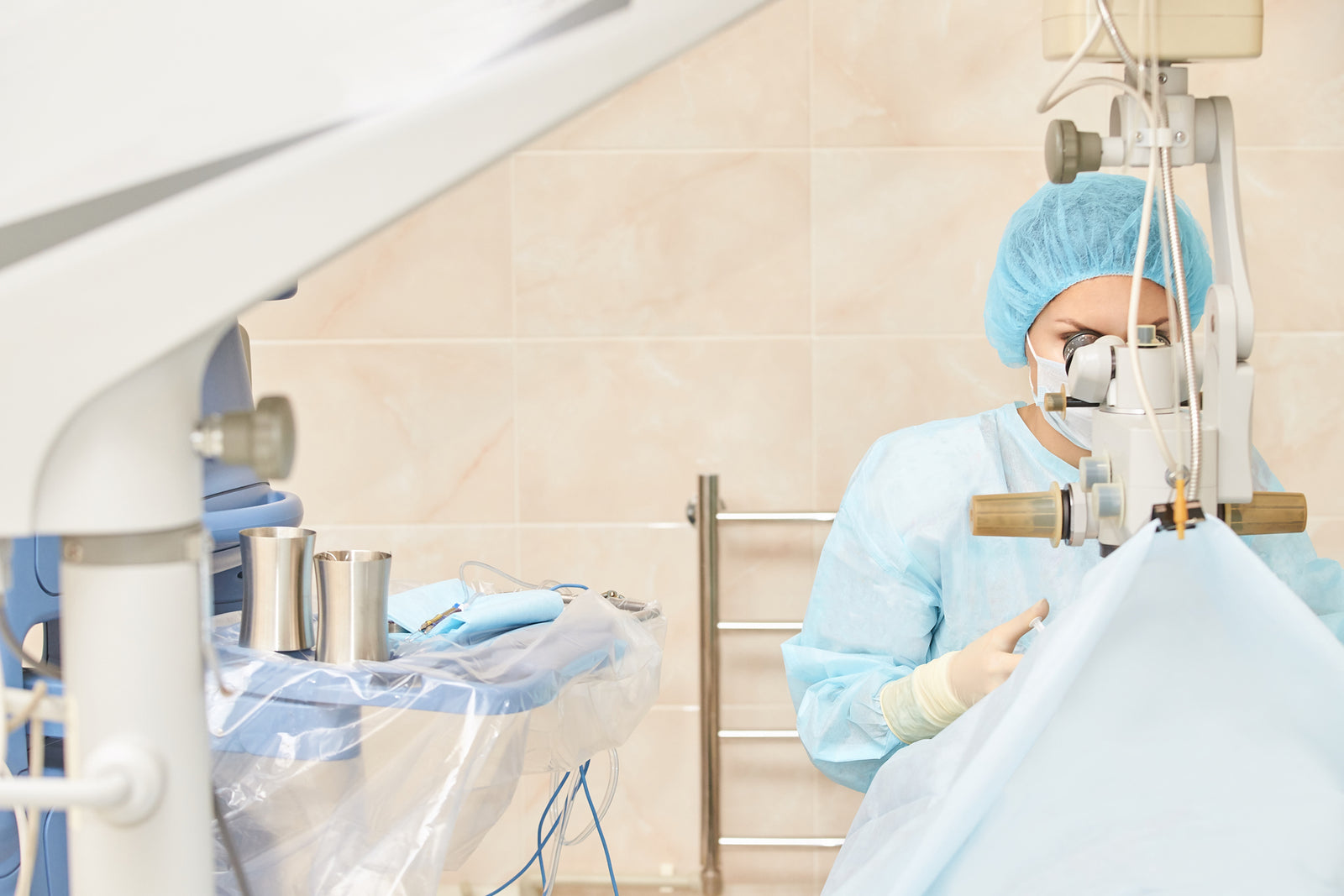 A doctor performs a surgery.