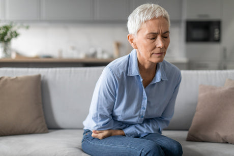 Woman holding stomach