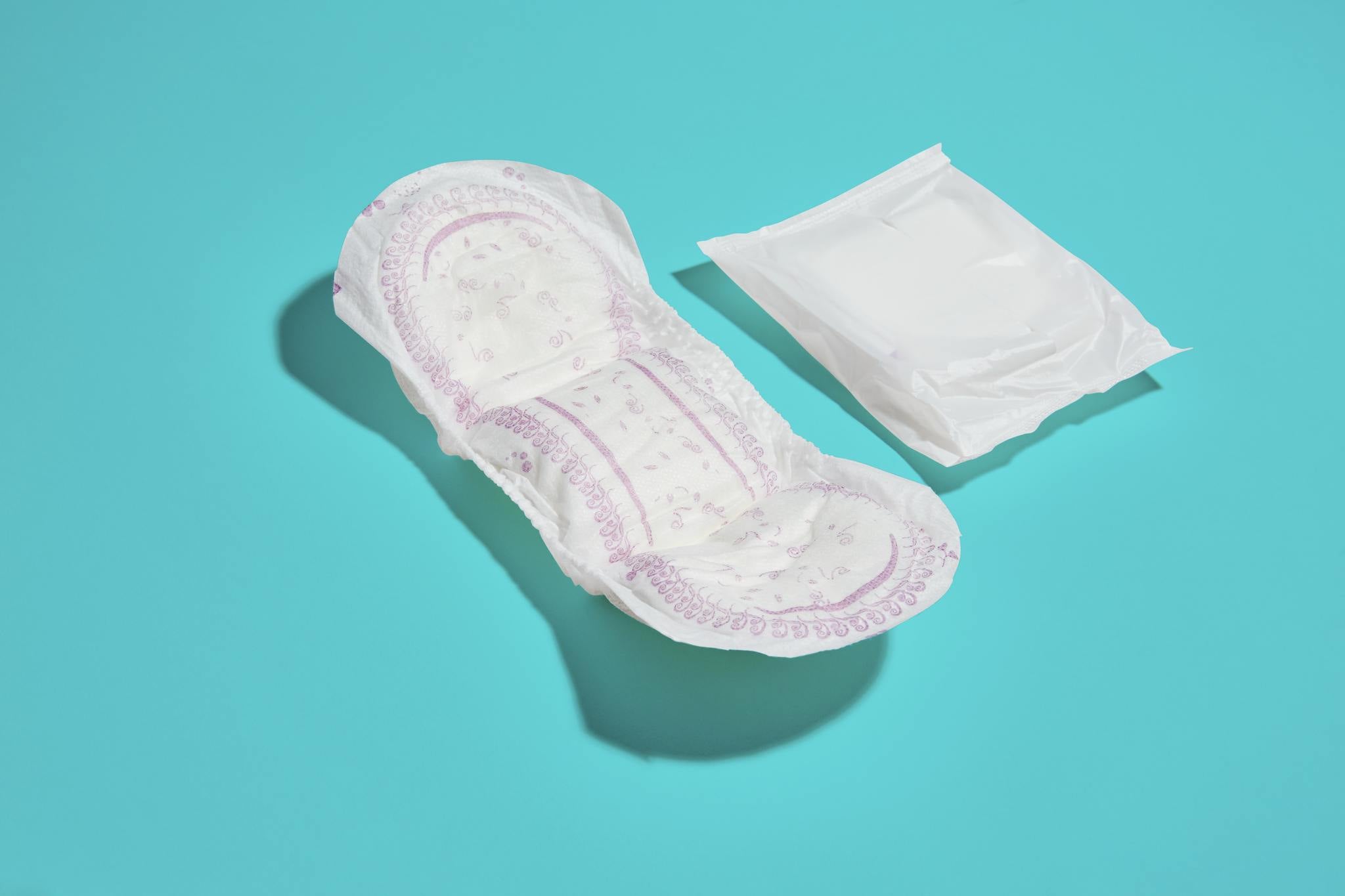 securing incontinence pads to mattress