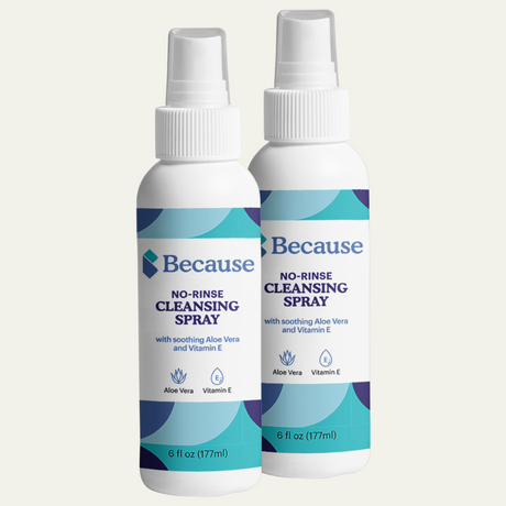 Two bottles of Because no-rinse cleansing spray on a white background