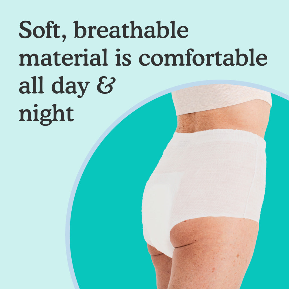 Woman wearing white overnight underwear that looks absorbent and sleek