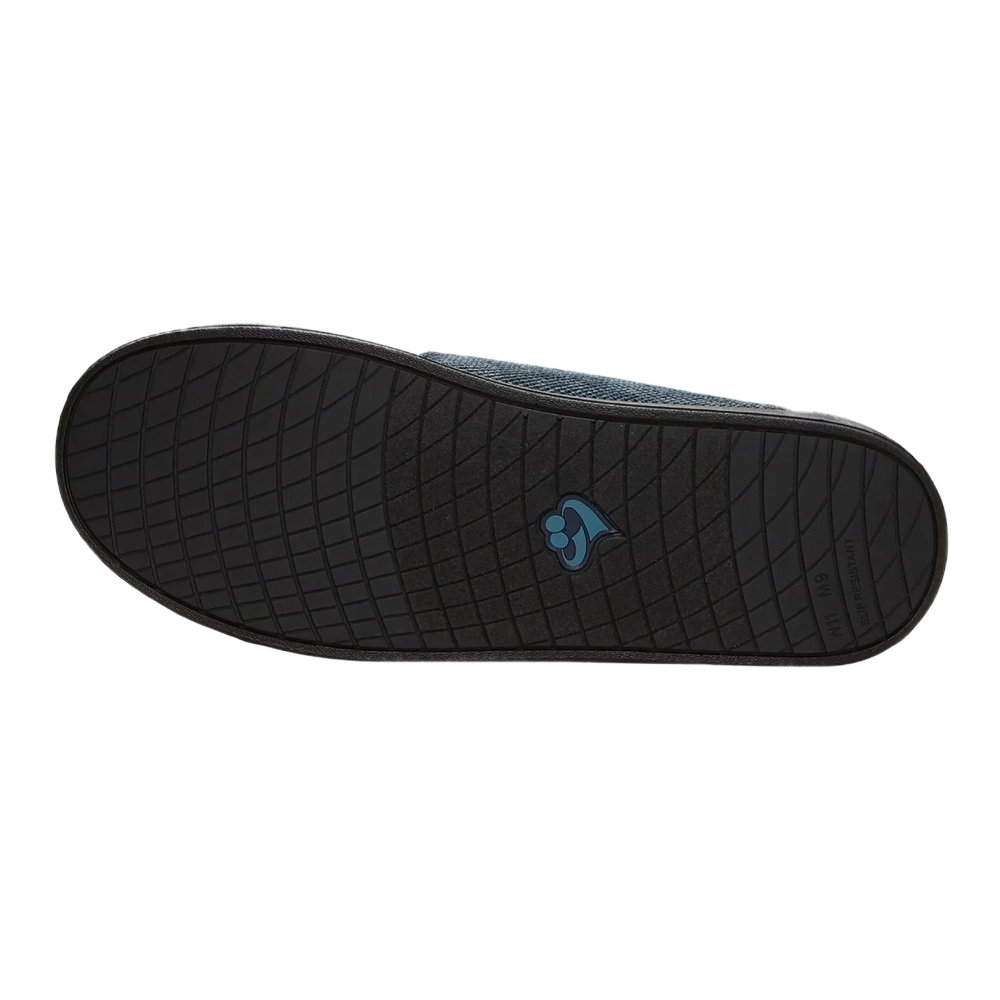 Silvert's extra wide slip resistant slippers in steel grey viewed from the bottom to show the sole.