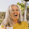 A woman laughing.