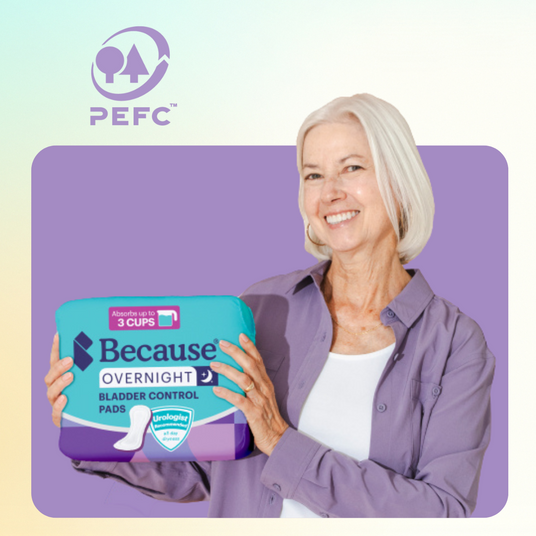 A woman holds a pack of Because Market Overnight Pads.