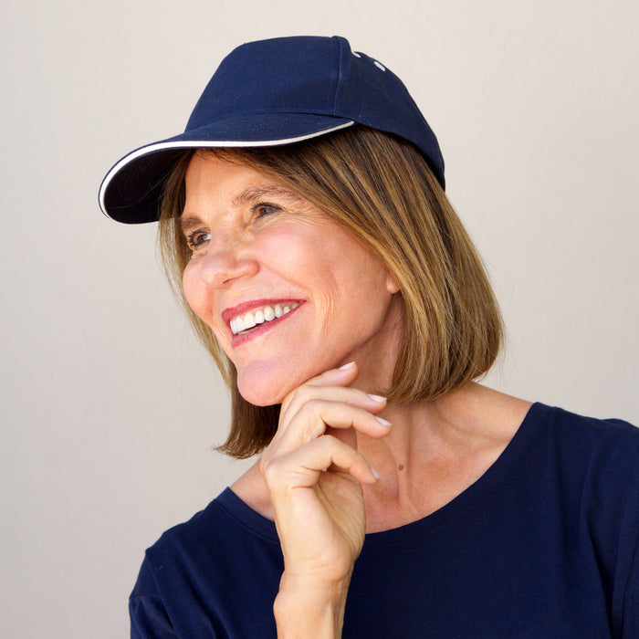 A woman in a hat.