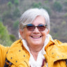 A woman poses with others.