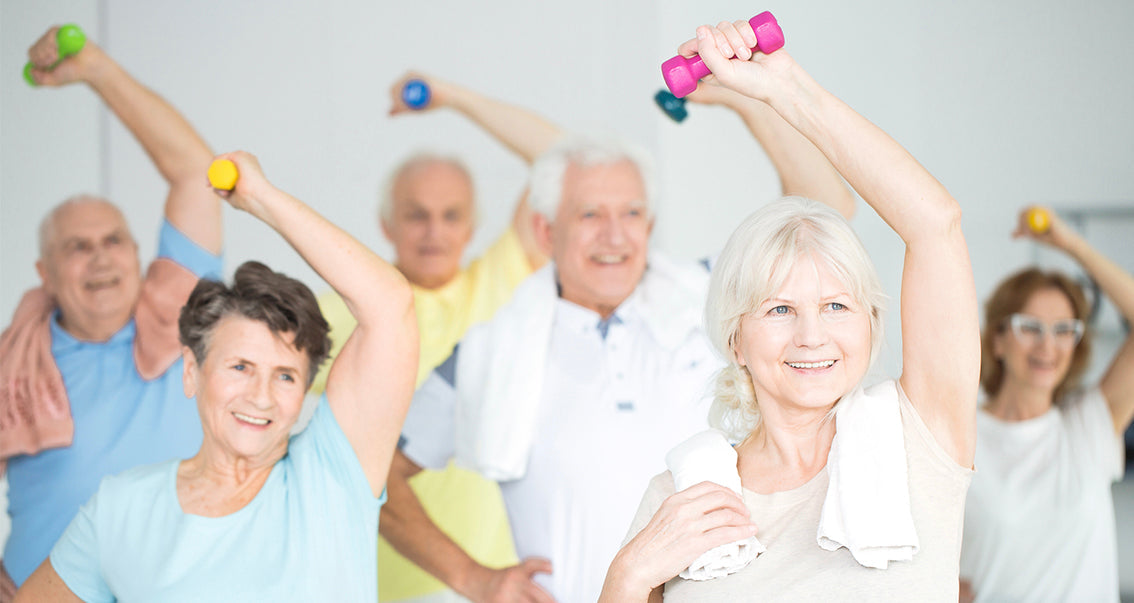 Older men and women working out with colorful handheld weights.