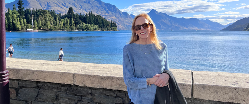 Woman smiling by a lake