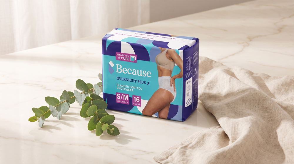 Because Overnight Plus bladder control underwear packshot on a cream surface with eucalyptus