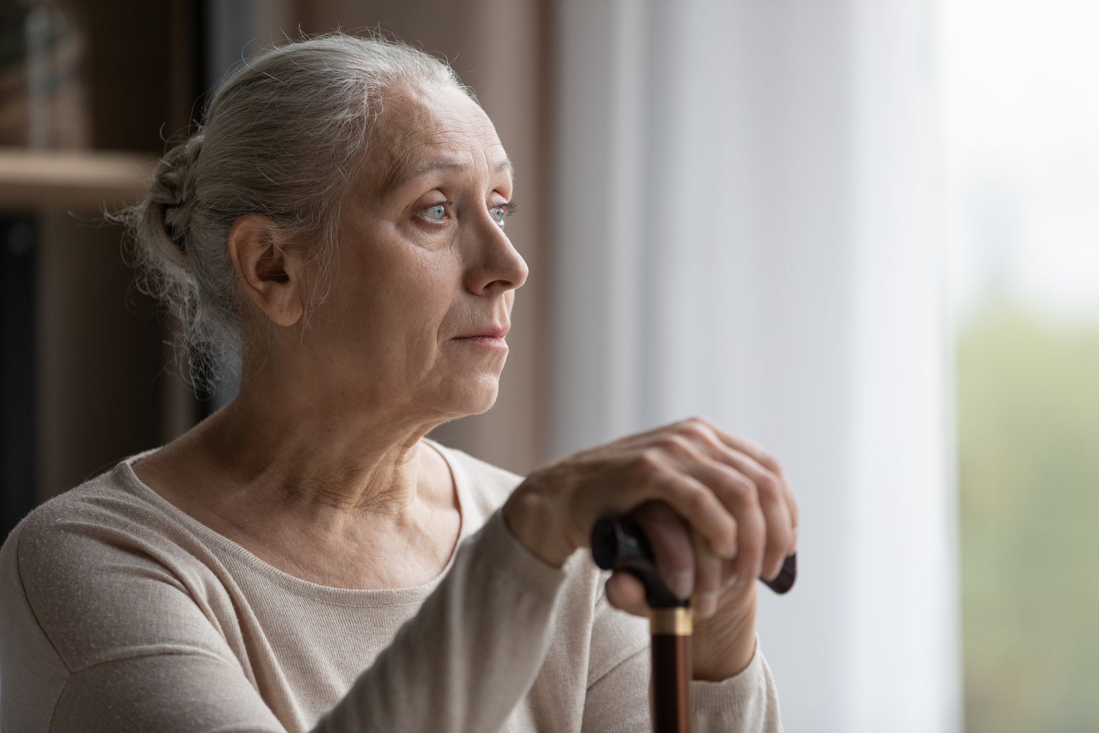 A woman looks off into the distance.