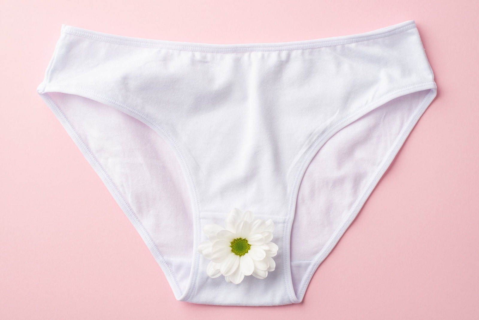 White cotton underwear on a pink background