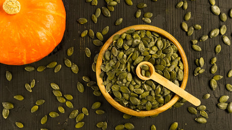 Healthy ripe pumpkin and pumpkin seeds in rustic vintage farm style