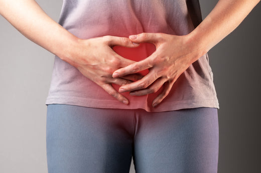 Woman with hands over her stomach