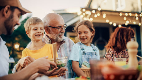 A grandfather with grandchildren.