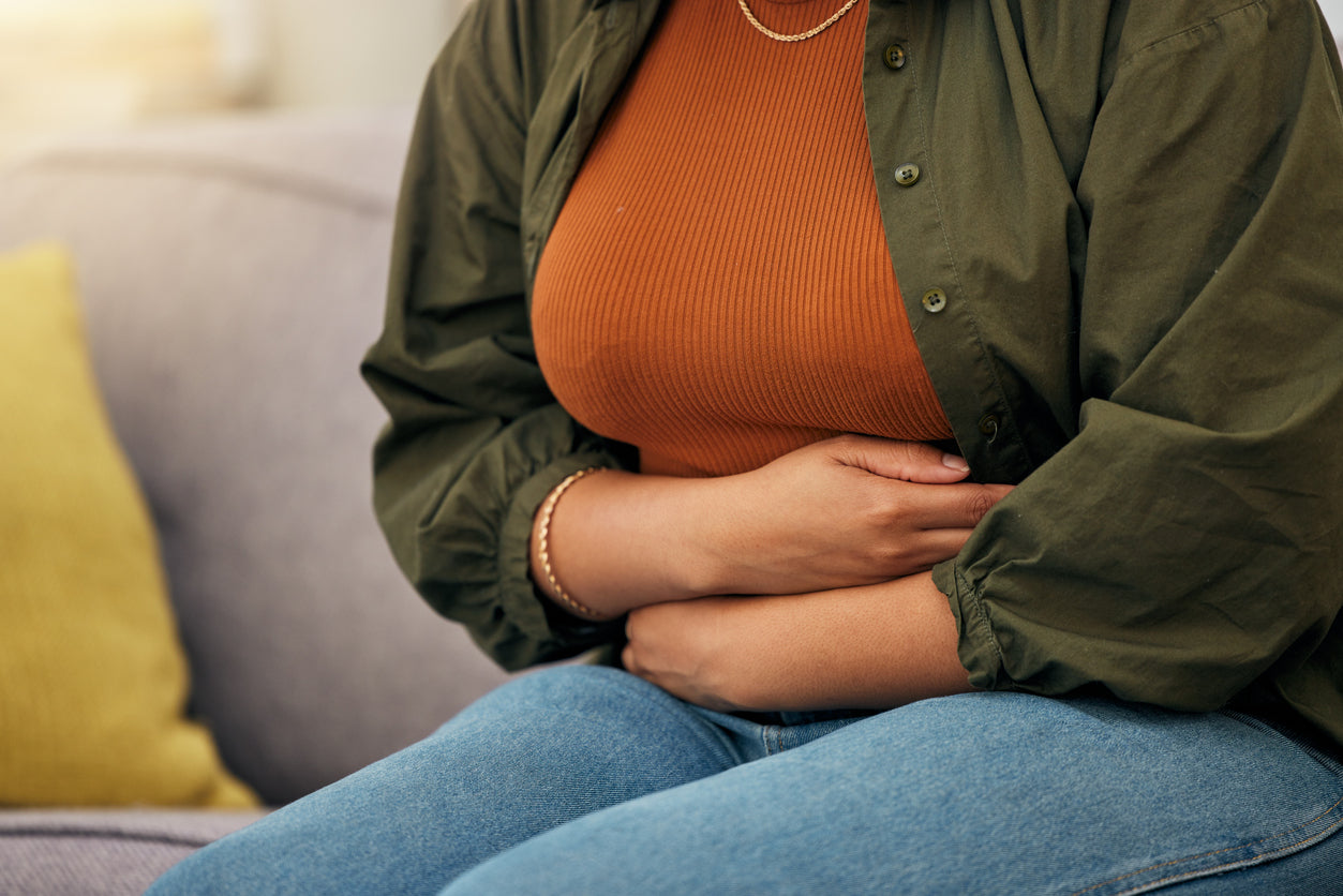 A person holding their stomach.