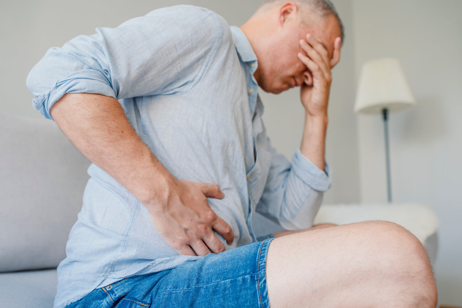 A man holding his stomach.