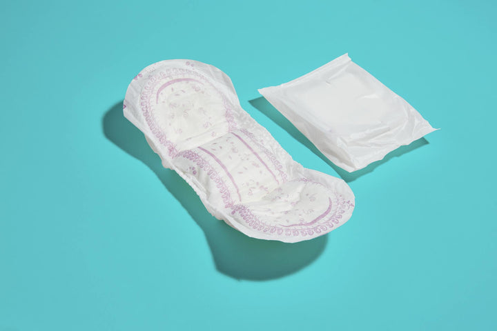 Pad laying next to an individually wrapped pad