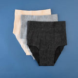 3 underwear in different colors: beige, black and grey