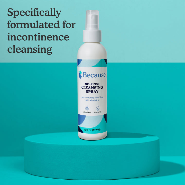 No-rinse cleansing spray bottle on a teal platform with a light blue background including text "formulated for incontinence cleansing"