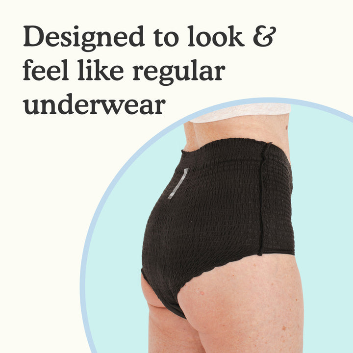 A model wearing Because Premium Maximum Plus Underwear for Women in Black on a white and light blue background