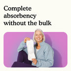 Woman holding a Because maximum bladder control pad with text "Complete absorbency without the bulk" on a white and pink background.