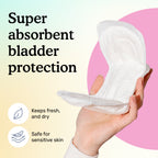 A hand holding one Moderate pad, curved to show its soft top layer, next to icons for keeps fresh and dry and safe for sensitive skin.