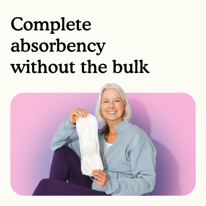 Woman holding a Because moderate bladder control pad with text "Complete absorbency without the bulk" on a white and pink background.