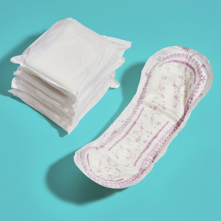 Because overnight pad opened because a stack of pads on teal background. 