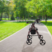 Side view of red rollator to show the four wheeled design and hand brakes