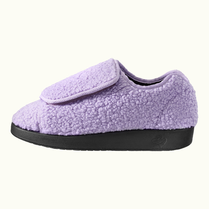 Side view of Silvert Women's Extra-Wide Easy Closure Slippers in purple on white background