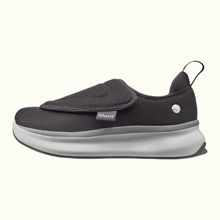 Side view of Black Women's Extra Wide Comfort Shoes with gray and white soles on a white background