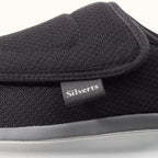 Up close view of Black Men's Extra Wide Comfort Shoes with gray soles on a white background