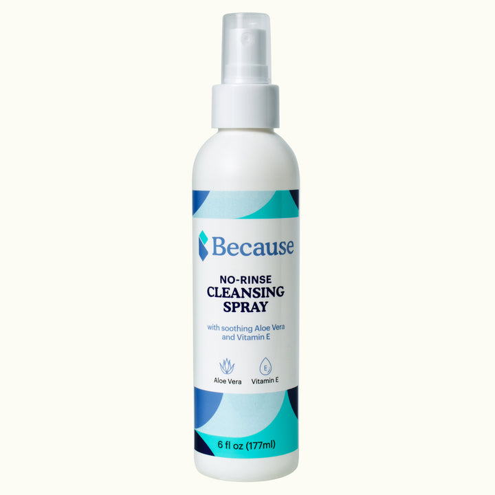 Bottle of Because no-rinse cleansing spray on white background
