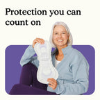 Woman holding a Because Ultimate Overnight bladder control pad product with text 'Protection you can count on' on a white background