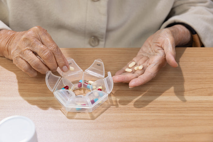 A person sorting pills.