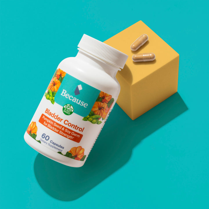 Because bladder control supplement bottle with pumpkin and soy beans on label. Two yellow Bladder Control Capsules on top of box with two capsules 