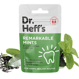 Package of Dr Heffs mints alongside a sprig of green mint