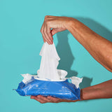 A woman pulling out a XL wipe