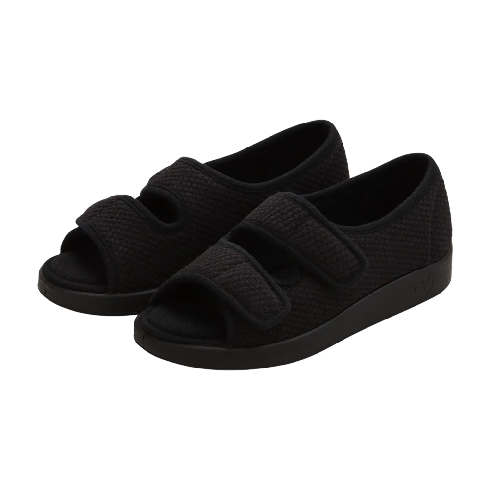 Side view of black velvet open toed sandals