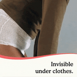 A woman pulling up her jeans over overnight underwear with no visible lines