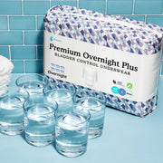 Premium overnight plus underwear sitting next to six cups of water 