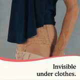 A woman pulling pants over premium maximum underwear to show that it is not visible under clothes