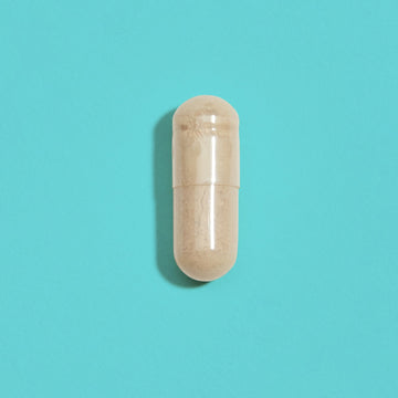 Capsule containing light beige powder